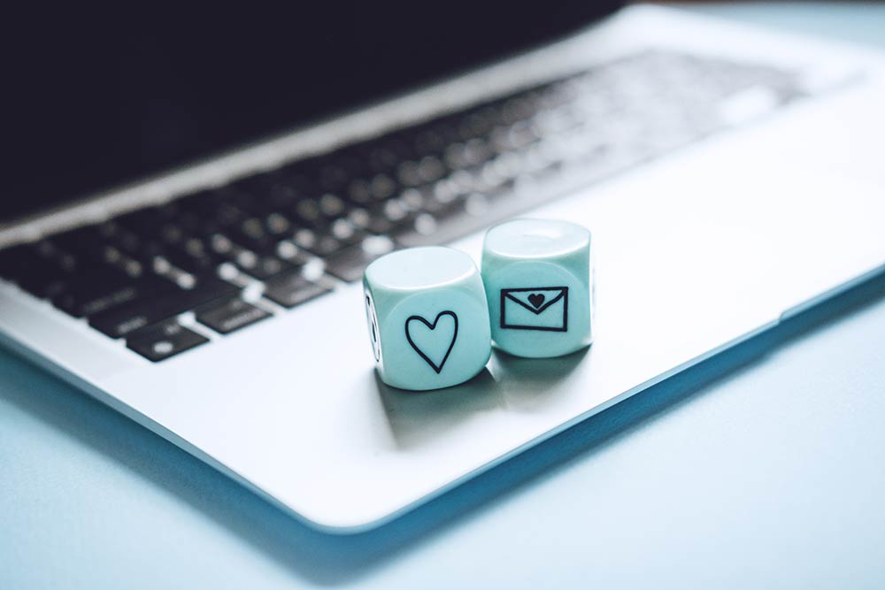 Email Marketing Services (Two Dice on a Laptop Representing a Good Outcome)